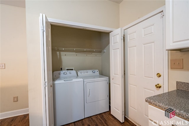 laundry room featuring washer and clothes dryer and dark hardwood / wood-style floors