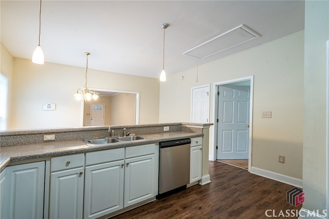 kitchen featuring stainless steel dishwasher, dark hardwood / wood-style floors, sink, and pendant lighting