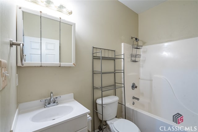 full bathroom featuring vanity, toilet, and bathing tub / shower combination