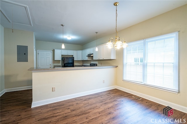 kitchen featuring electric panel, black fridge, white cabinets, kitchen peninsula, and pendant lighting