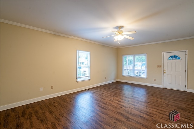 interior space featuring ceiling fan, dark hardwood / wood-style floors, and ornamental molding