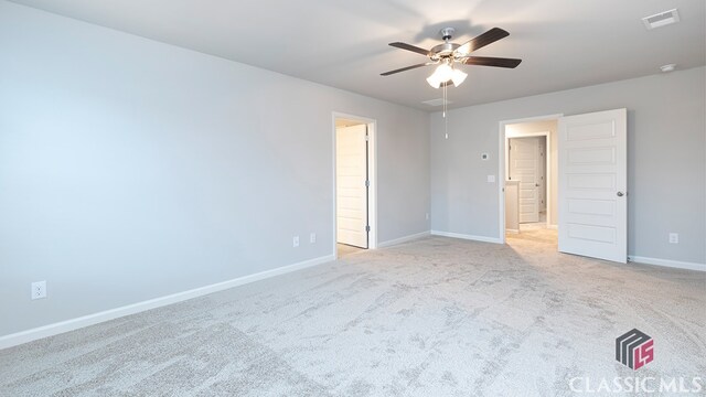 carpeted empty room with ceiling fan