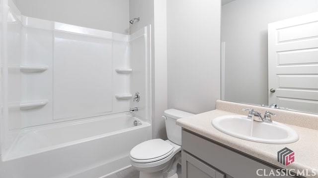 full bathroom featuring vanity, bathtub / shower combination, and toilet