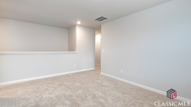 basement featuring light colored carpet