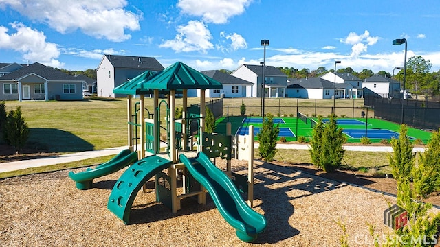 view of play area featuring a lawn