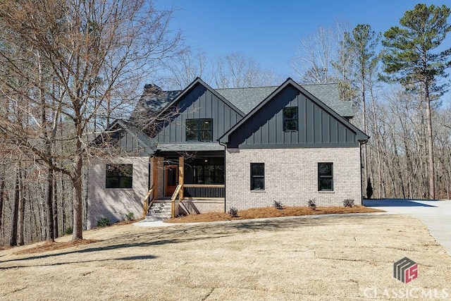 modern farmhouse featuring covered porch