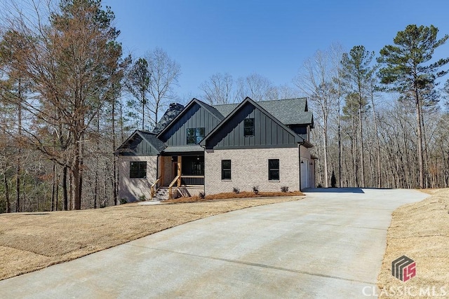 view of front of house featuring a garage and covered porch