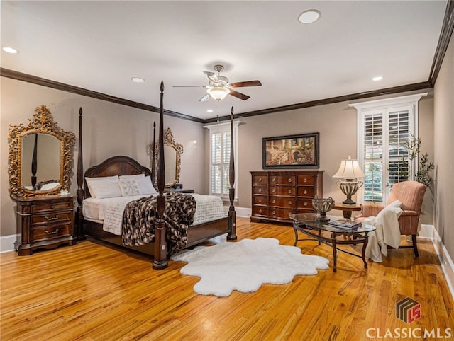 bedroom featuring wood-type flooring, ceiling fan, and crown molding