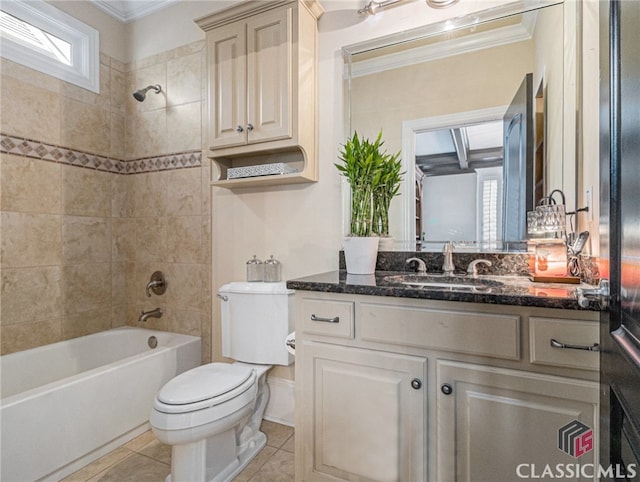 full bathroom with vanity, toilet, crown molding, and tiled shower / bath combo