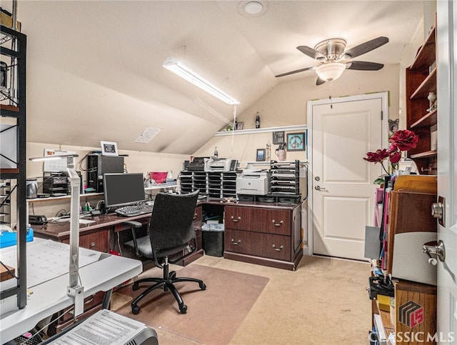 home office featuring ceiling fan, light carpet, and vaulted ceiling