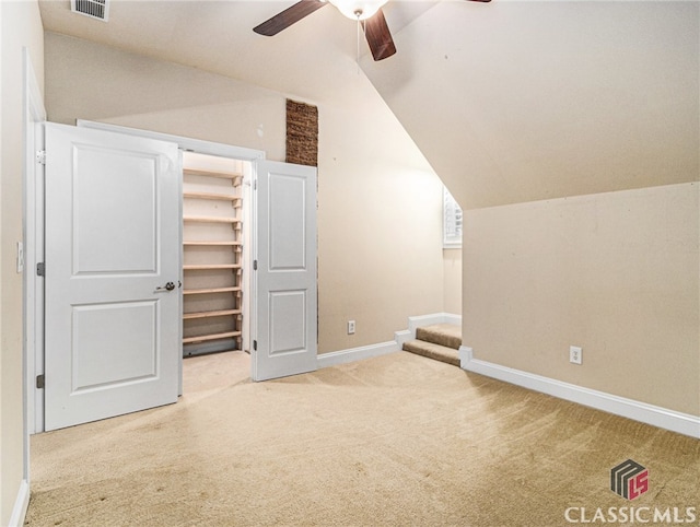 bonus room with ceiling fan, carpet floors, and vaulted ceiling