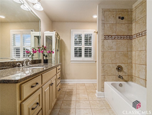 bathroom with tile patterned flooring and vanity