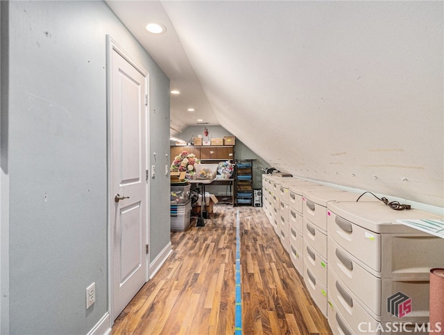 bonus room featuring lofted ceiling and wood-type flooring