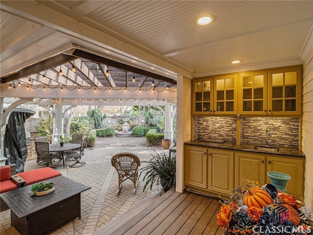 deck with a gazebo, a patio area, and sink