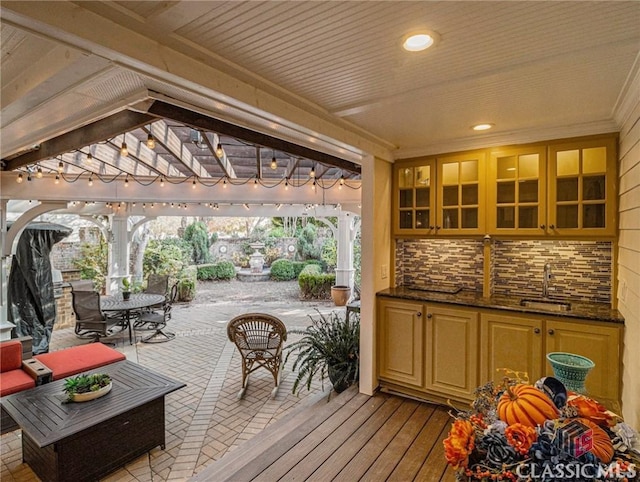 deck featuring a sink, a patio area, outdoor dining area, and outdoor lounge area