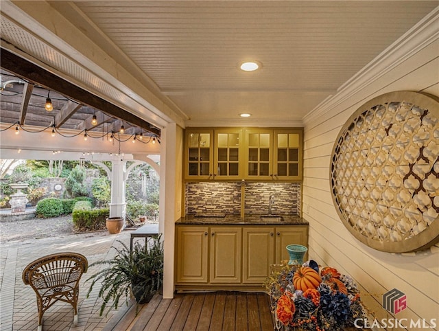 exterior space with wood walls, dark hardwood / wood-style flooring, and sink