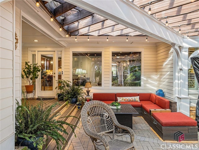 view of patio with an outdoor living space and a pergola