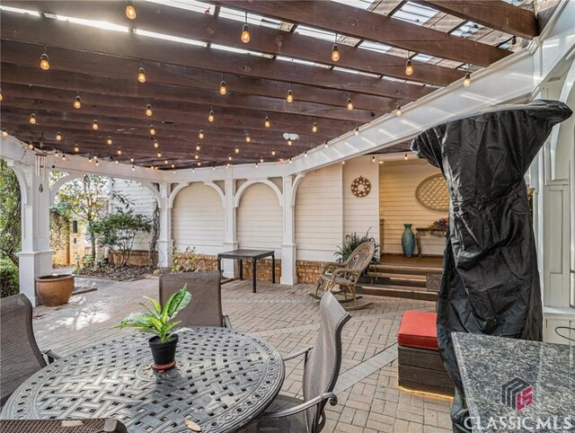 wooden deck featuring a sink and a pergola