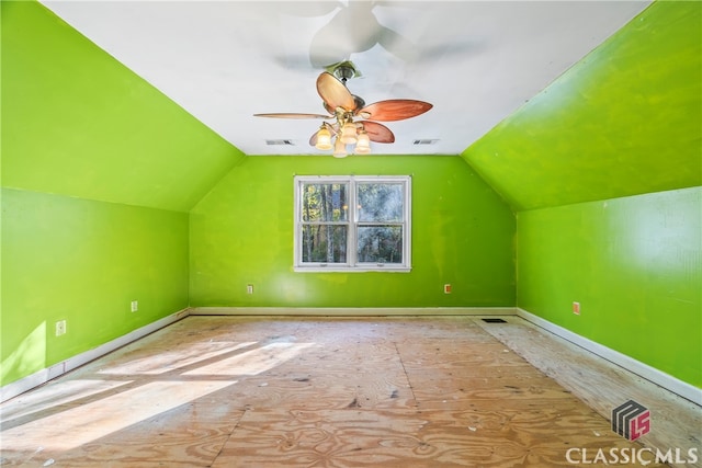 additional living space with vaulted ceiling and ceiling fan