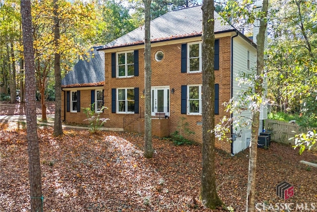 colonial inspired home with central AC unit