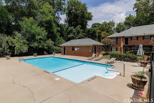 view of swimming pool featuring a patio area