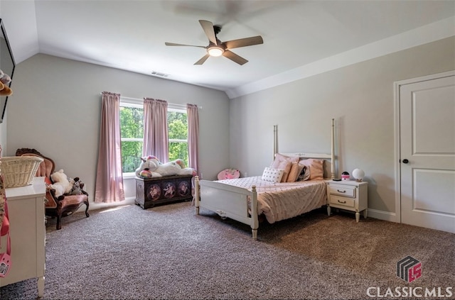 carpeted bedroom with vaulted ceiling and ceiling fan