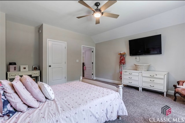 bedroom with ceiling fan, lofted ceiling, and carpet