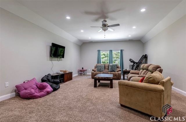 carpeted living room with lofted ceiling and ceiling fan