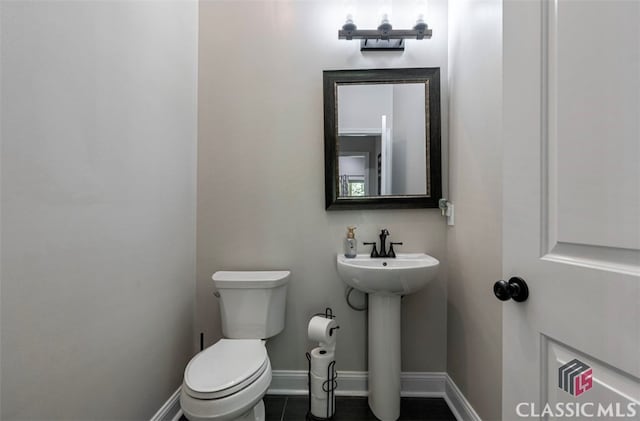 bathroom with toilet and sink