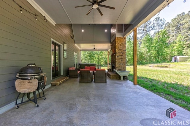 view of patio / terrace with ceiling fan and outdoor lounge area