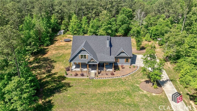 view of front of home with a front yard and covered porch