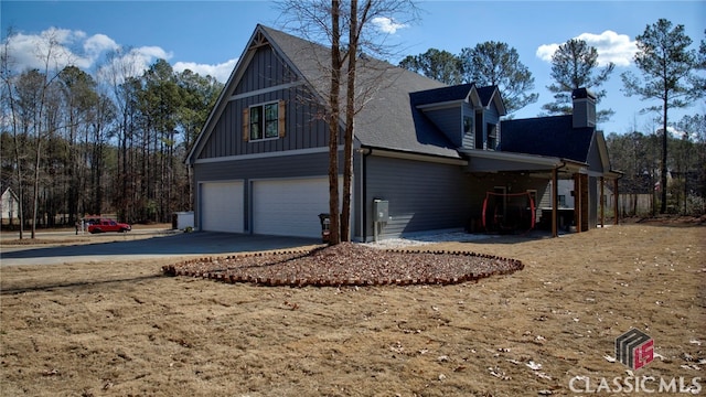 view of side of home with a garage