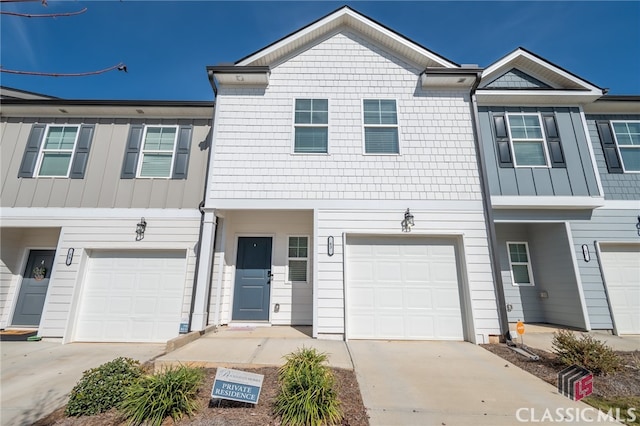 townhome / multi-family property featuring a garage