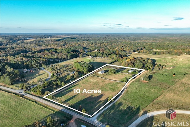 birds eye view of property featuring a rural view