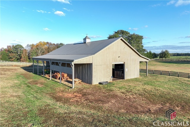 view of outdoor structure featuring a rural view