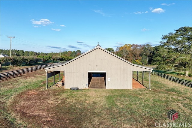 view of outdoor structure with a rural view