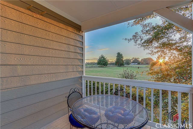 view of balcony at dusk