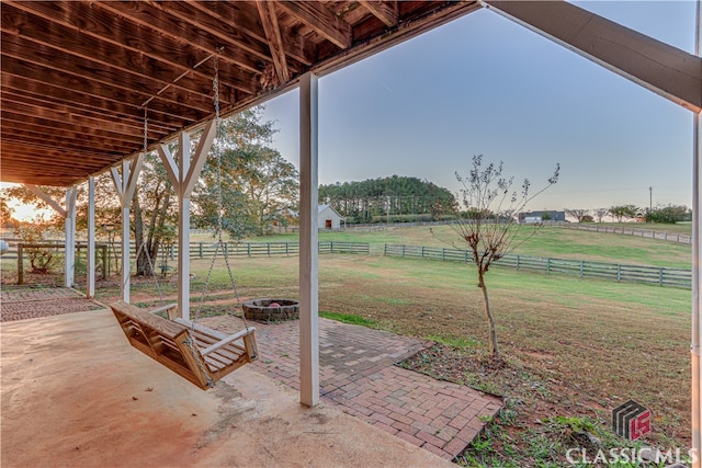 view of yard featuring a patio area and a rural view