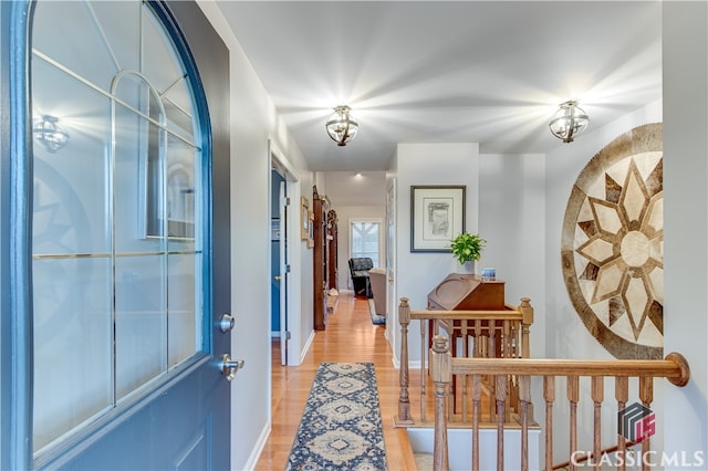 hallway with light wood-type flooring