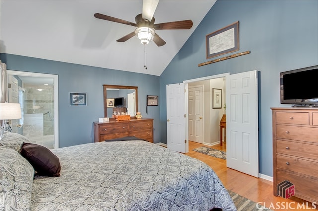 bedroom with light wood-type flooring, ceiling fan, high vaulted ceiling, and connected bathroom