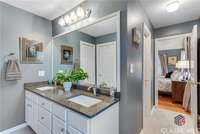 bathroom with vanity and tile patterned floors