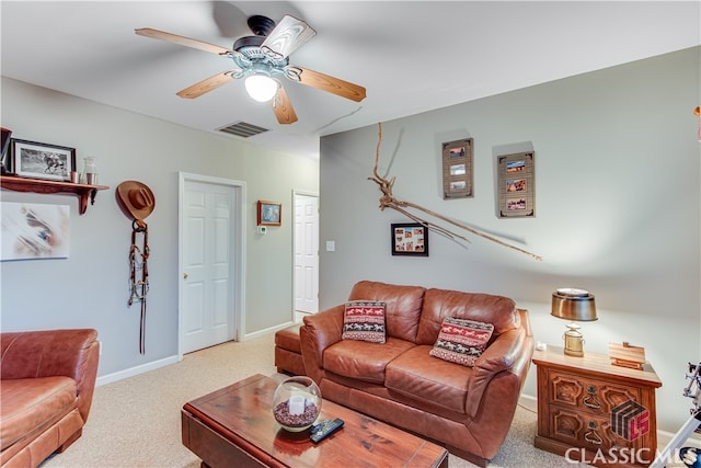 carpeted living room featuring ceiling fan