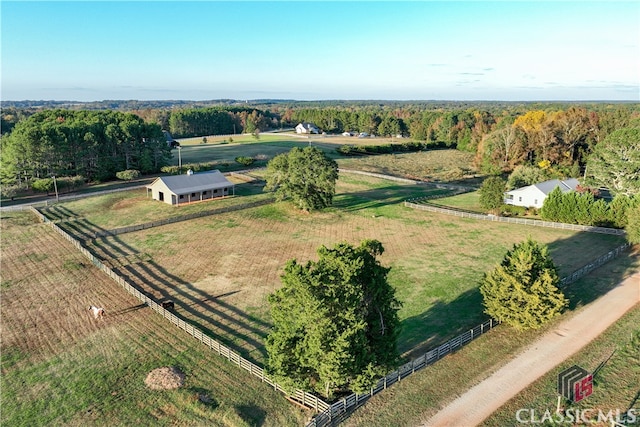 birds eye view of property with a rural view