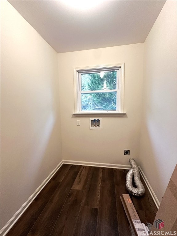 clothes washing area with hookup for an electric dryer, hookup for a washing machine, and dark hardwood / wood-style flooring