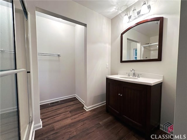 bathroom with hardwood / wood-style flooring and vanity