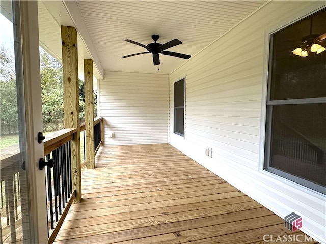 wooden terrace featuring ceiling fan