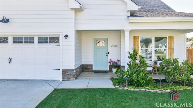 doorway to property featuring a garage