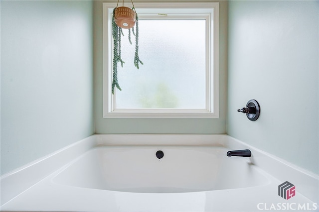 bathroom featuring a tub to relax in