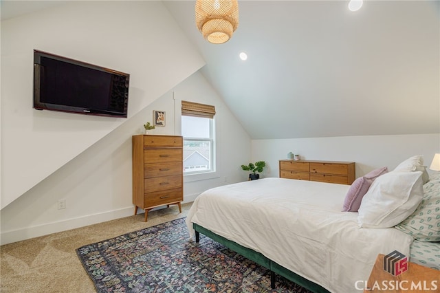 carpeted bedroom featuring vaulted ceiling