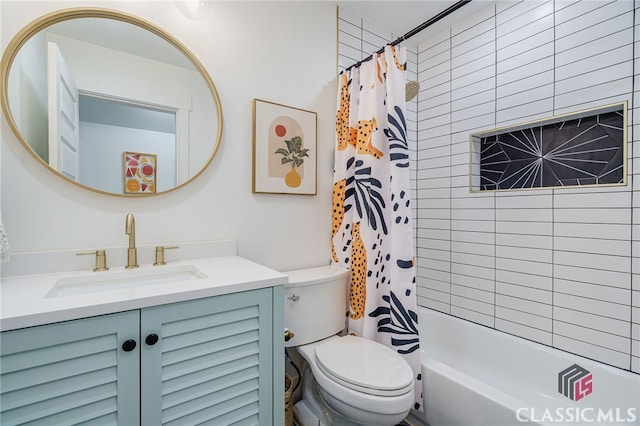 full bathroom featuring toilet, shower / tub combo, and vanity